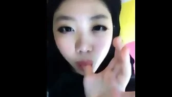 Amateur asian girl tasting herself