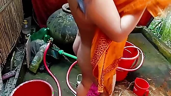 Beautiful Desi village girl bathing in the open.