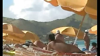 Beach voyeur video of a nude milf and a nude Asian hottie